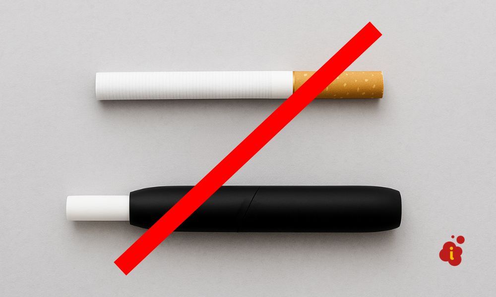 Cigarrillo y dispositivo de tabaco calentado formando un símbolo "≠" para destacar sus diferencias.
